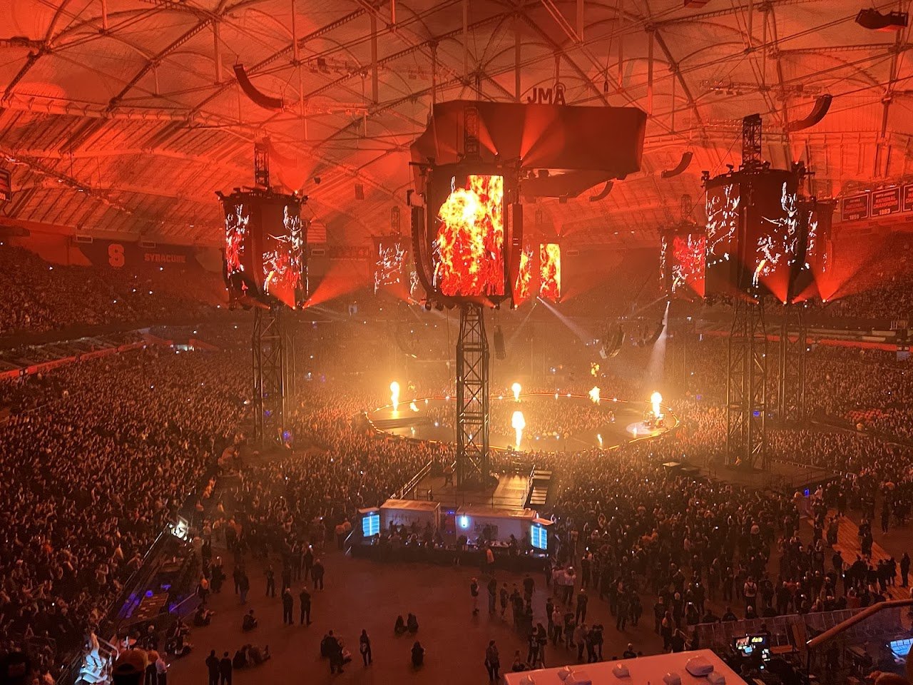 Metallica performing live in a massive arena in Syracuse, NY